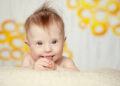 cheerful little baby girl with Downs Syndrome