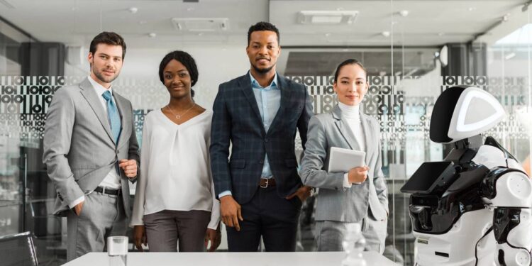 Colaboração entre humanos e IA otimizando processos e produtividade. - Créditos: depositphotos.com / VitalikRadko